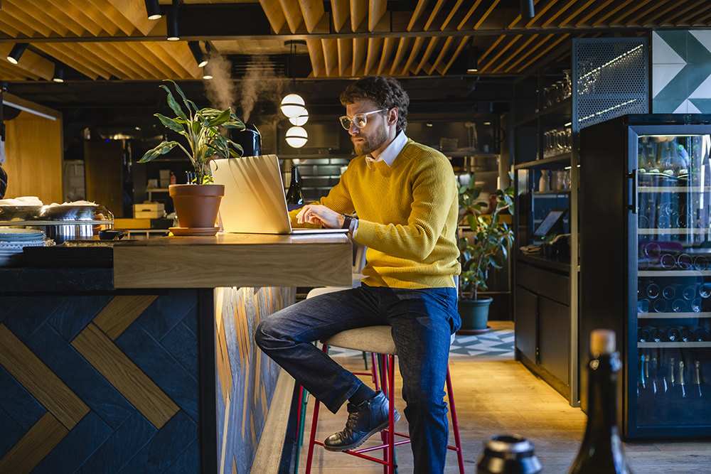 Man sitting at desk on laptop
